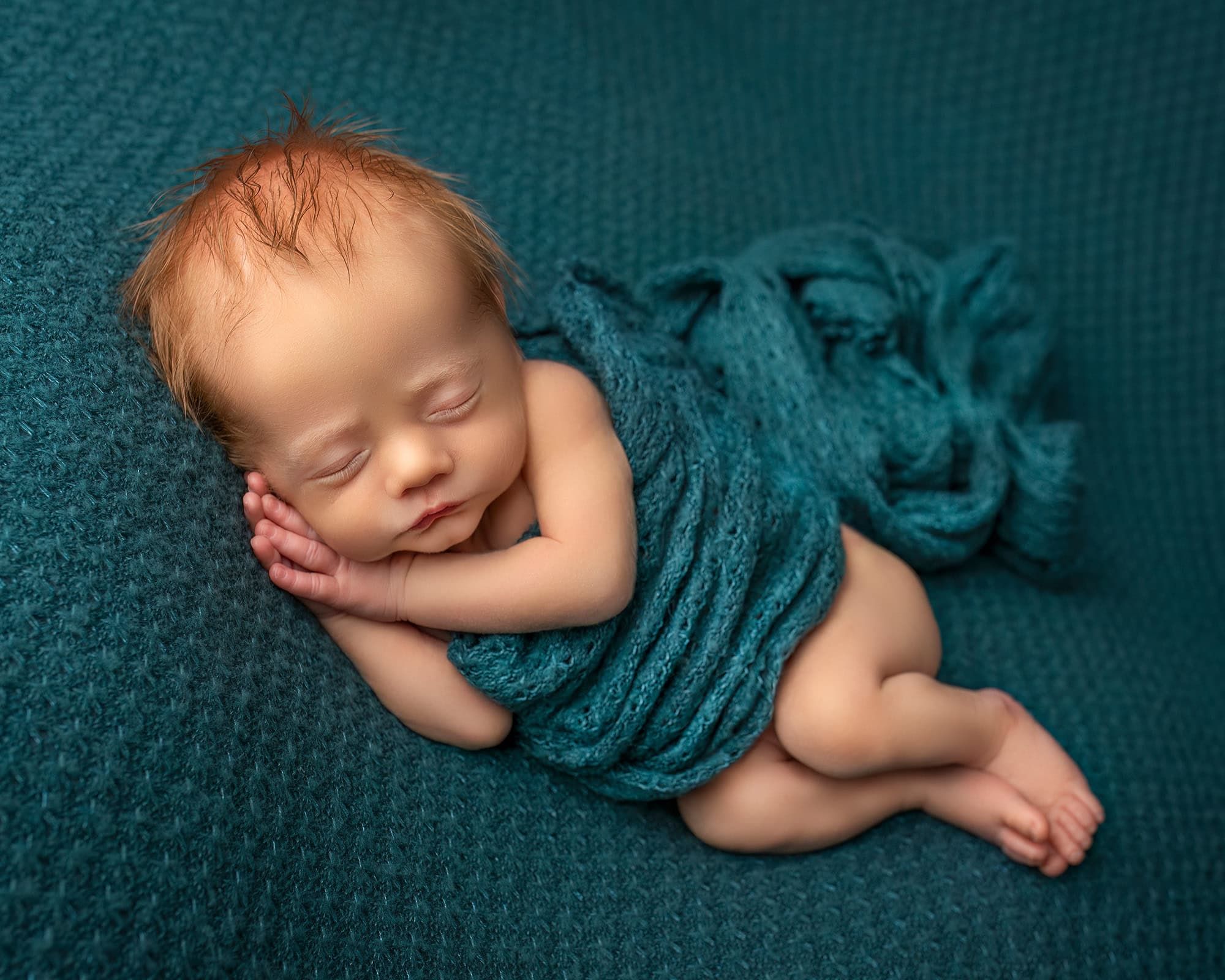 newborn infant photos newborn baby boy peacefully sleeping wrapped in turquoise