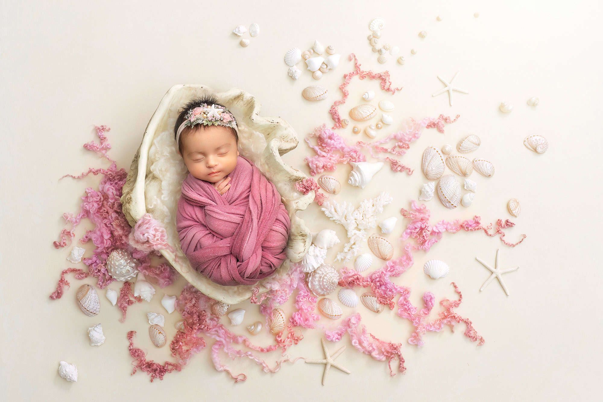 best newborn photographer Glastonbury swaddled newborn sleeping in white shell