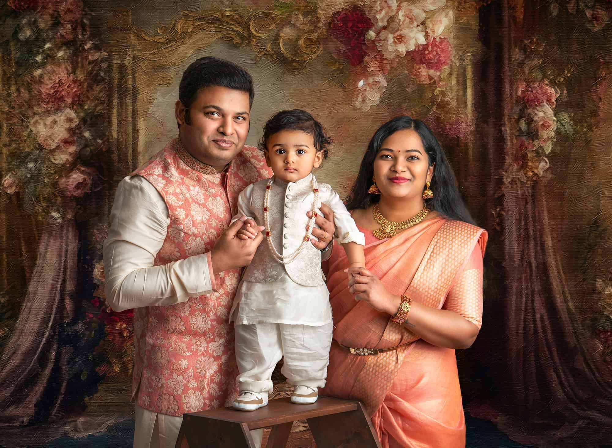 family professional pictures Indian family dressed in traditional indian costume with their 1 year old son on a studio background