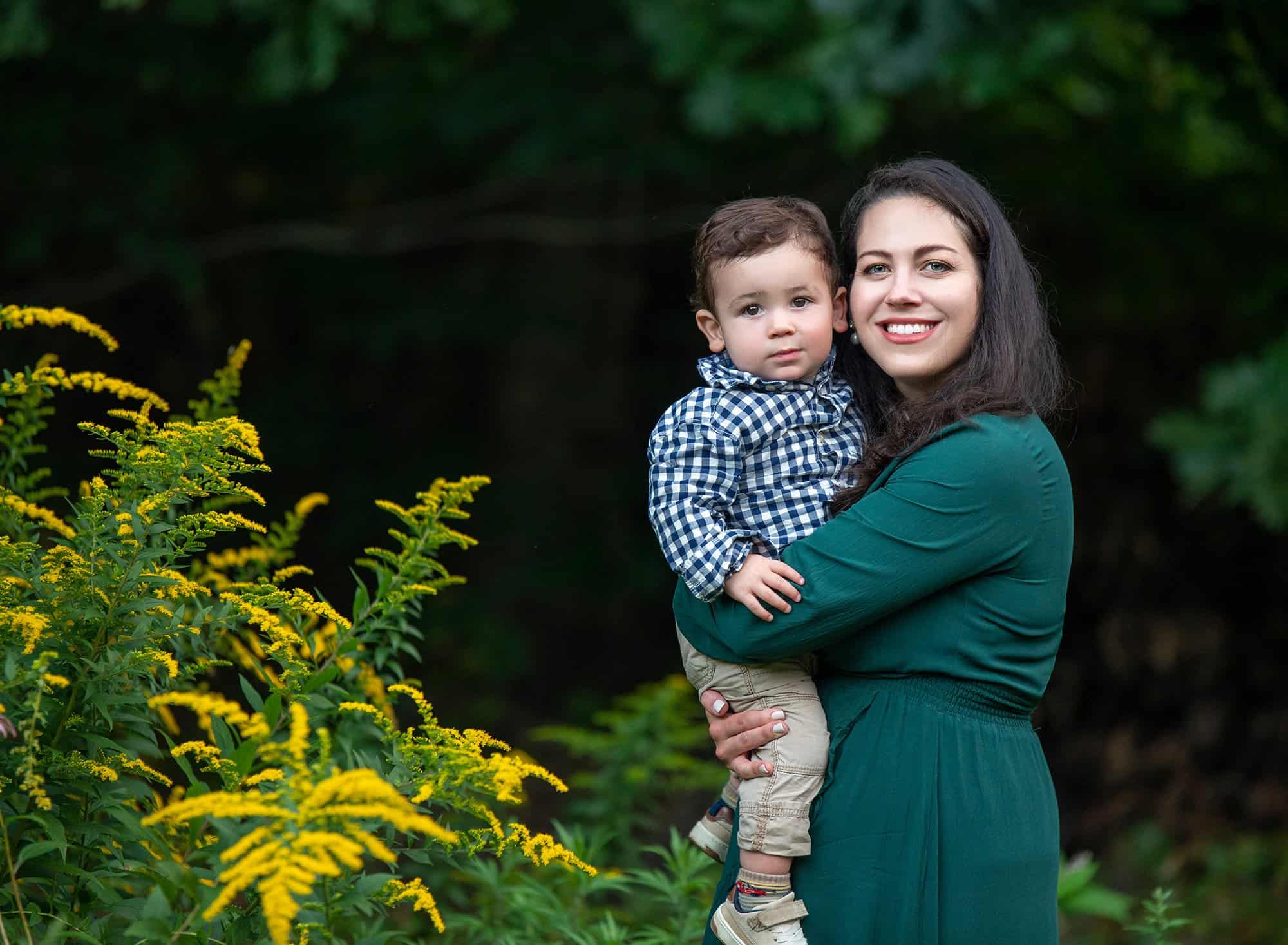 1 year old and family photography mom holding one year old son in nature