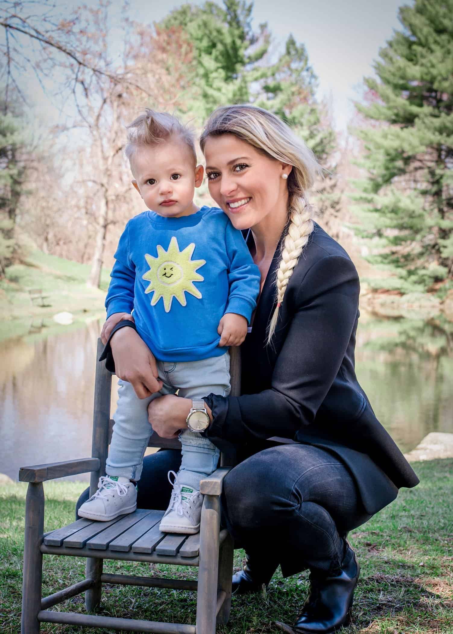 Mom with his 12 month old son standing on a chair