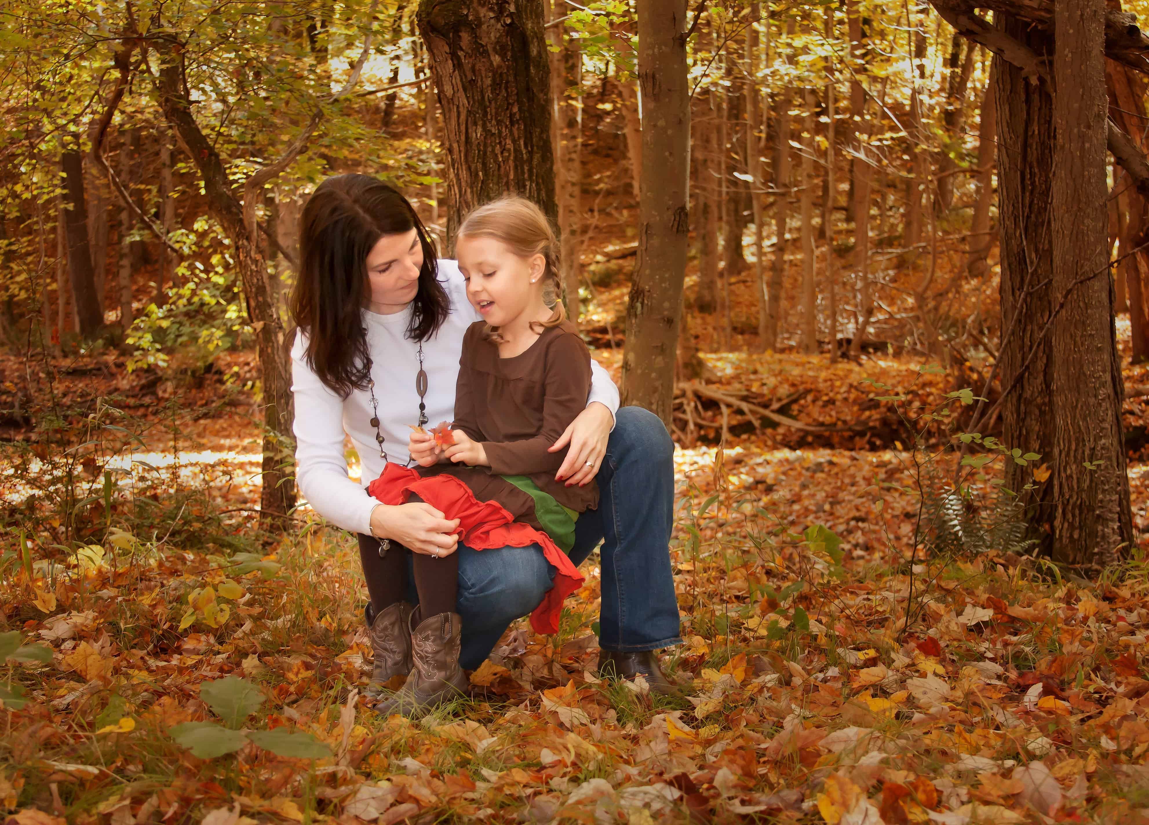Mom listening to young daughter tell her a story
