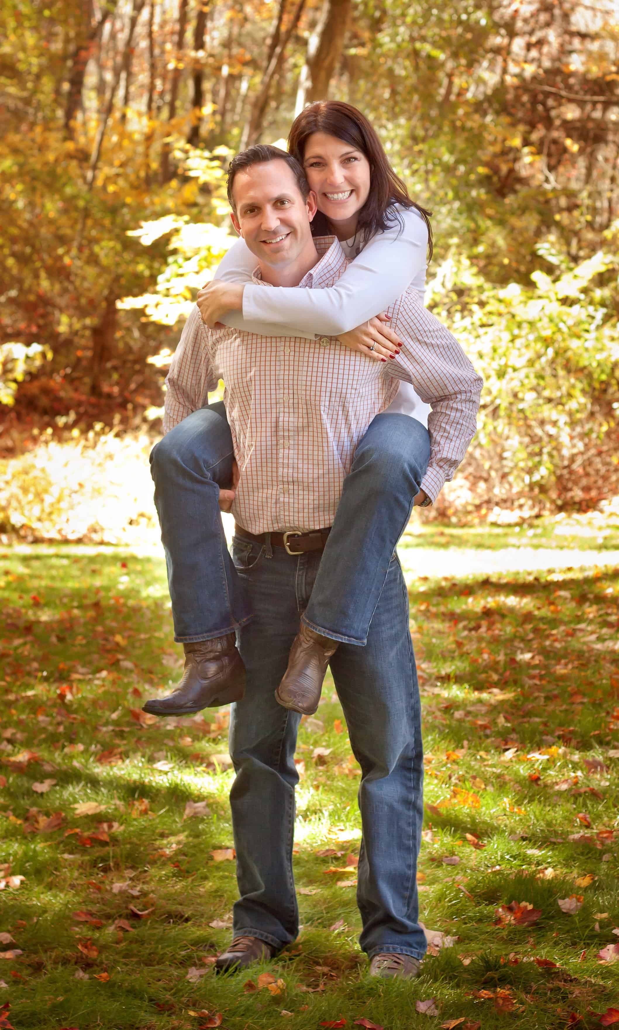 Dad giving Mom a piggy back ride
