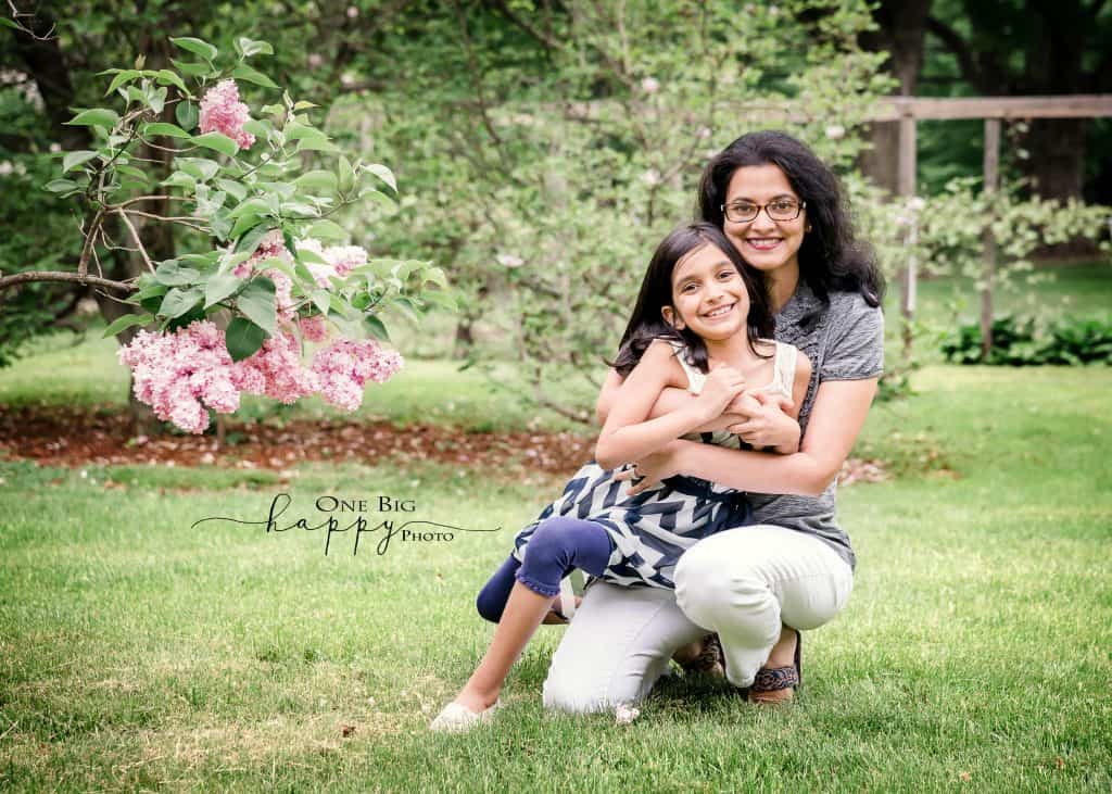 Mom and daughter portrait in summer garden