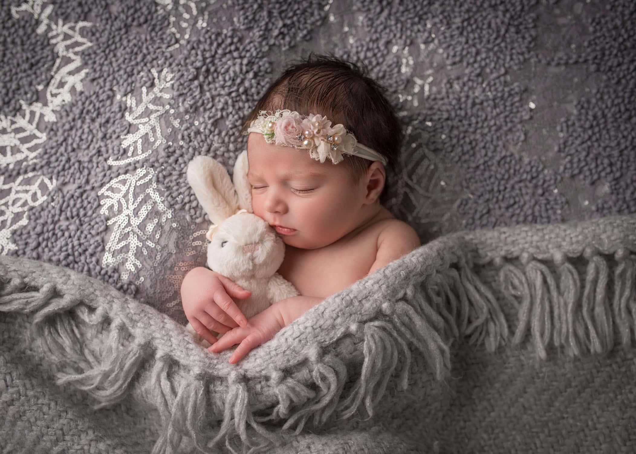 Best CT Newborn Photographer newborn baby girls sleeping with bunny on grey lace background