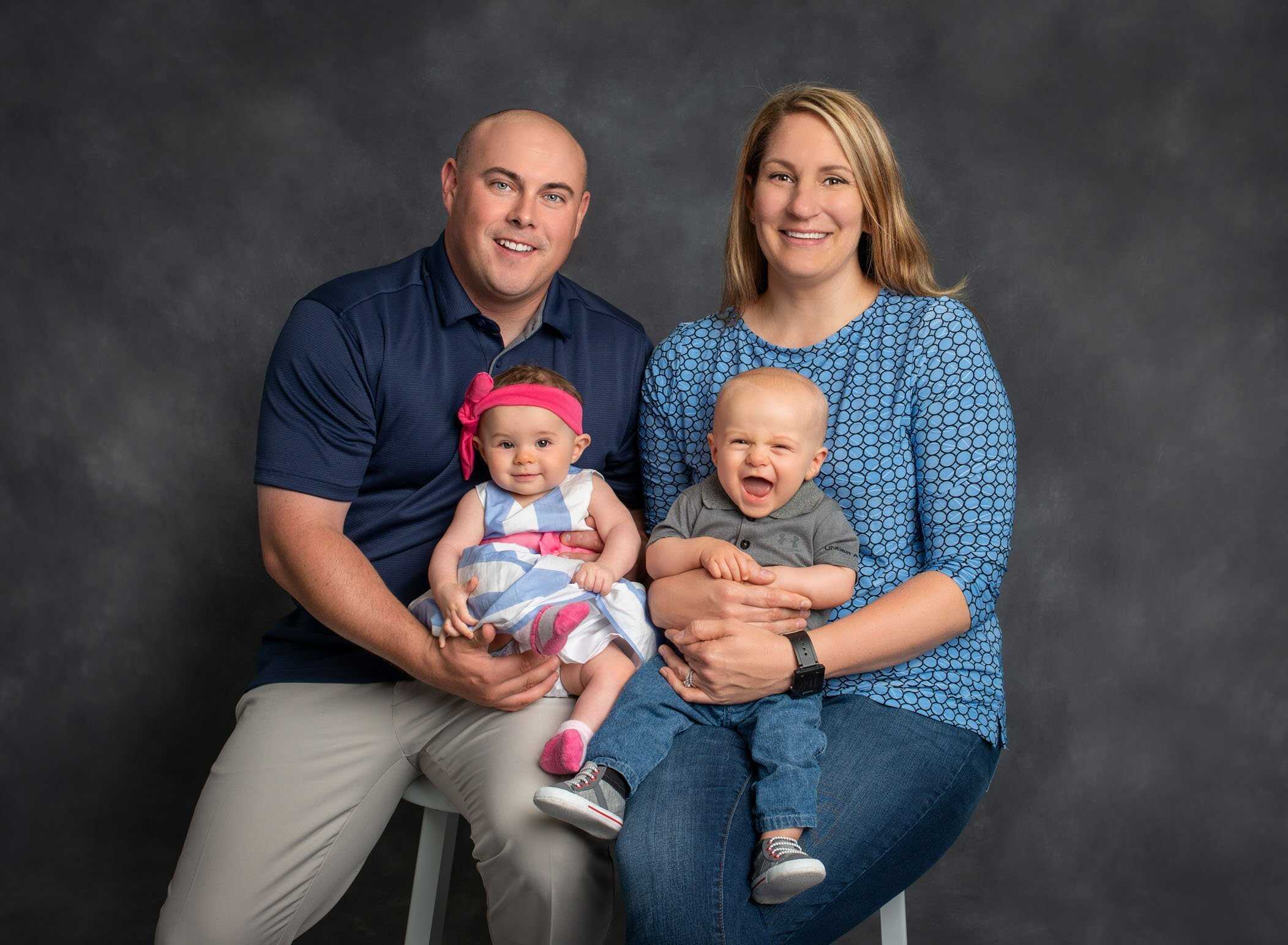 Family photograph of Mom Dad and girl boy twins