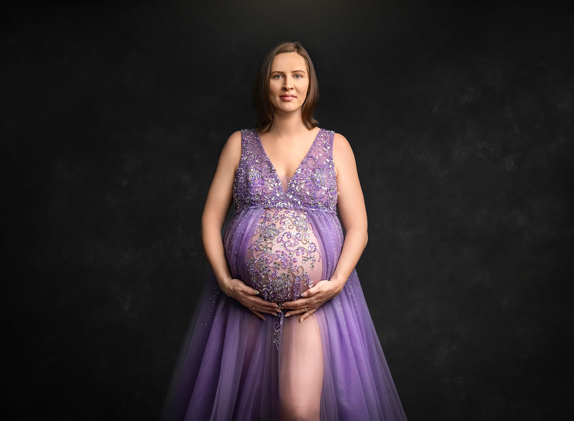 Expectant mother in lavender gown—calm mindset for preparing siblings for newborn photos