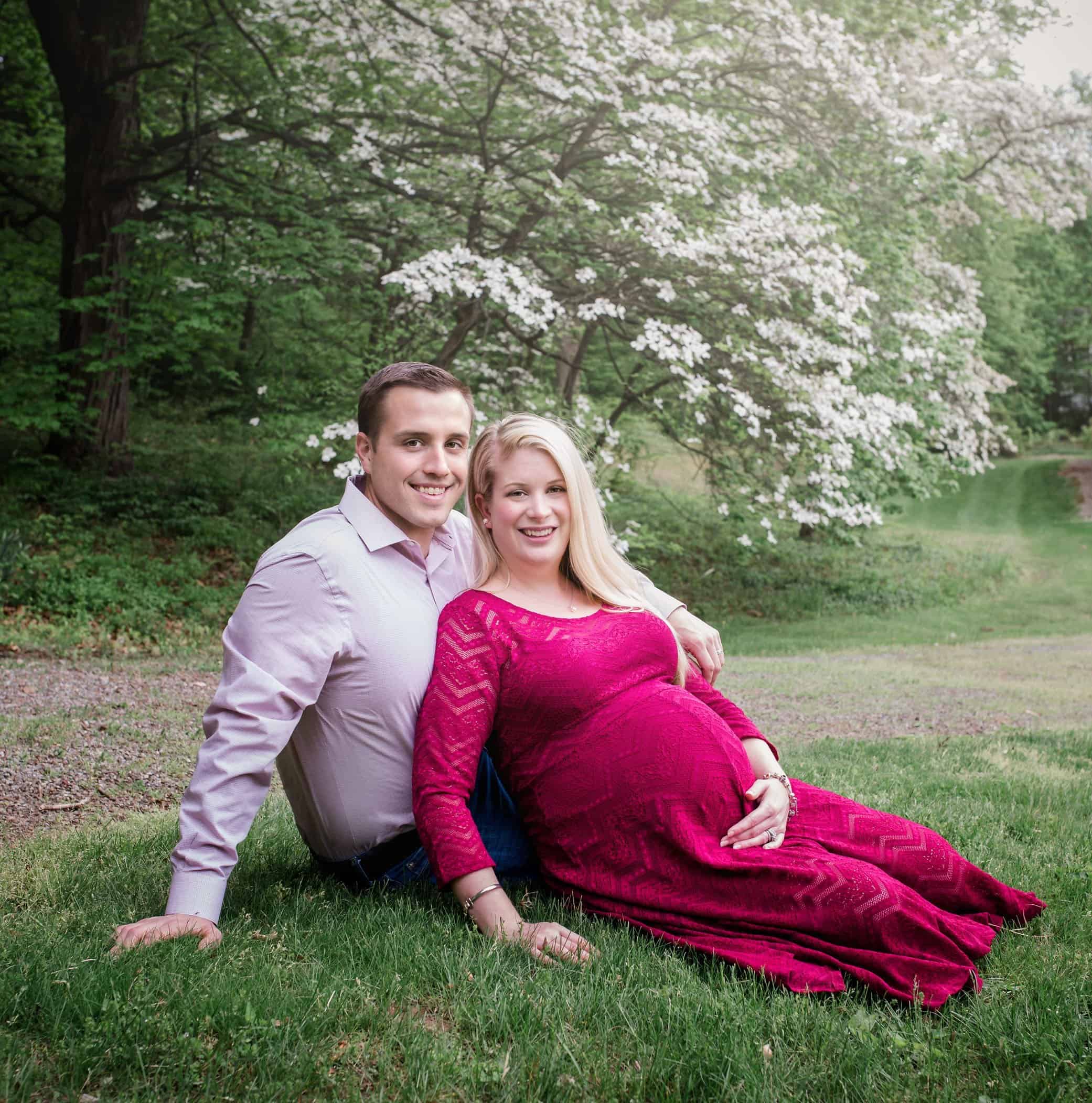 Maternity parents to be sitting in garden