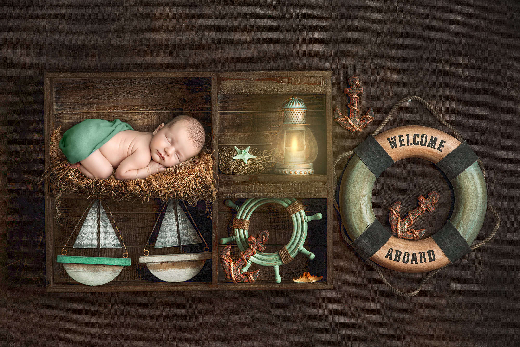 newborn photos with dogs—nautical crate scene with sleeping baby and vintage props