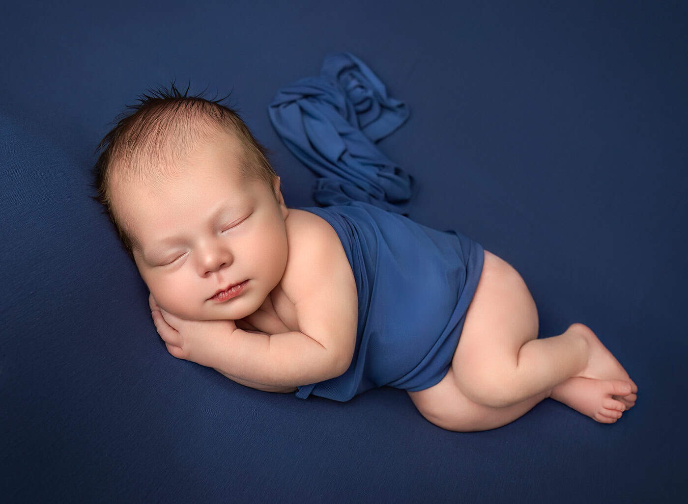 newborn boy photos sleeping on his side