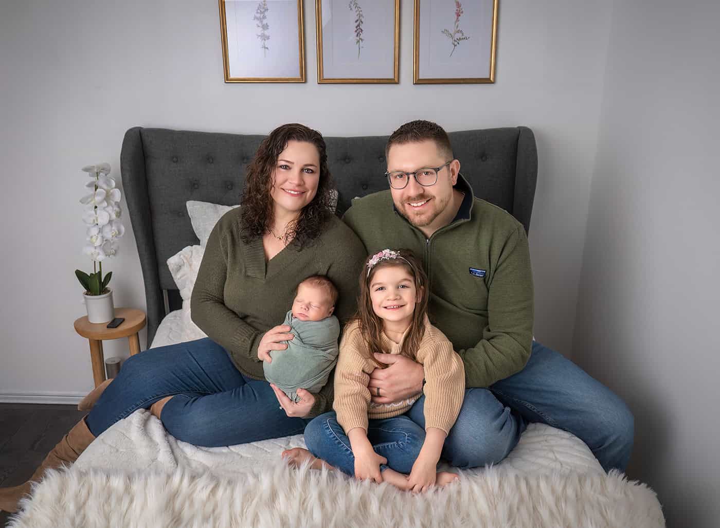 Family portrait with Mom, Dad, Charlotte, and baby Teddy smiling together