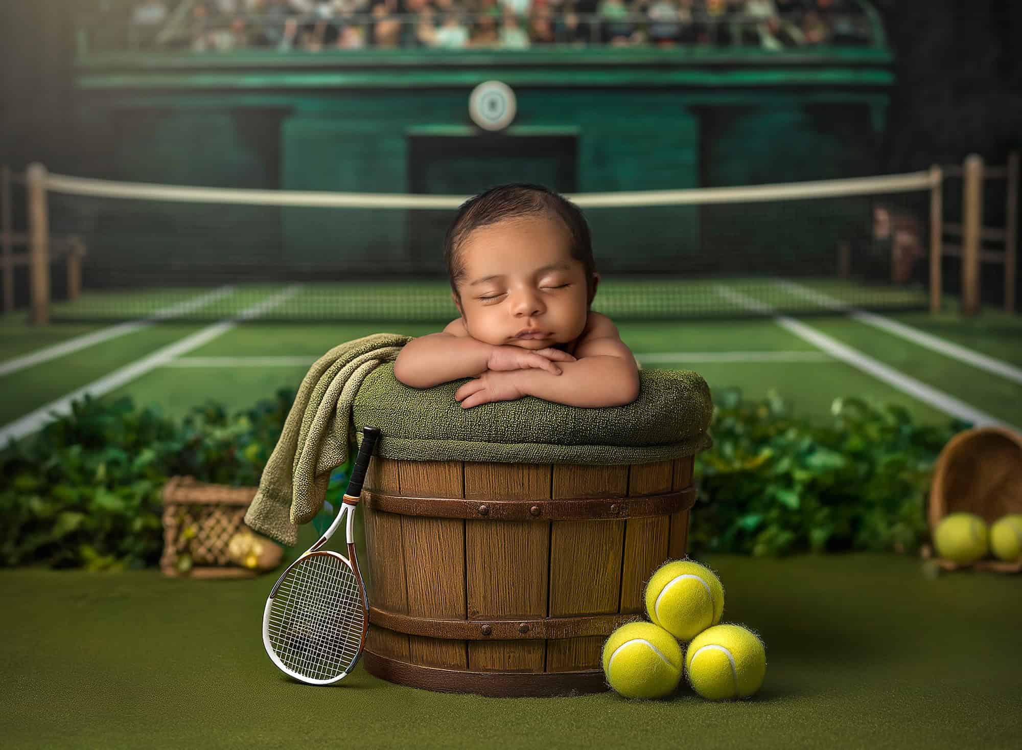 Connecticut newborn photographer baby sleeping in bucket on tennis court