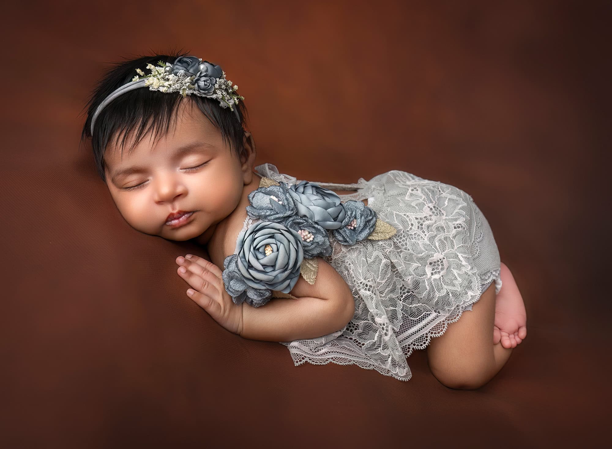 Luxury Newborn Photographer Glastonbury CT Newborn Anahita sleeping in gray lace on a brown backdrop