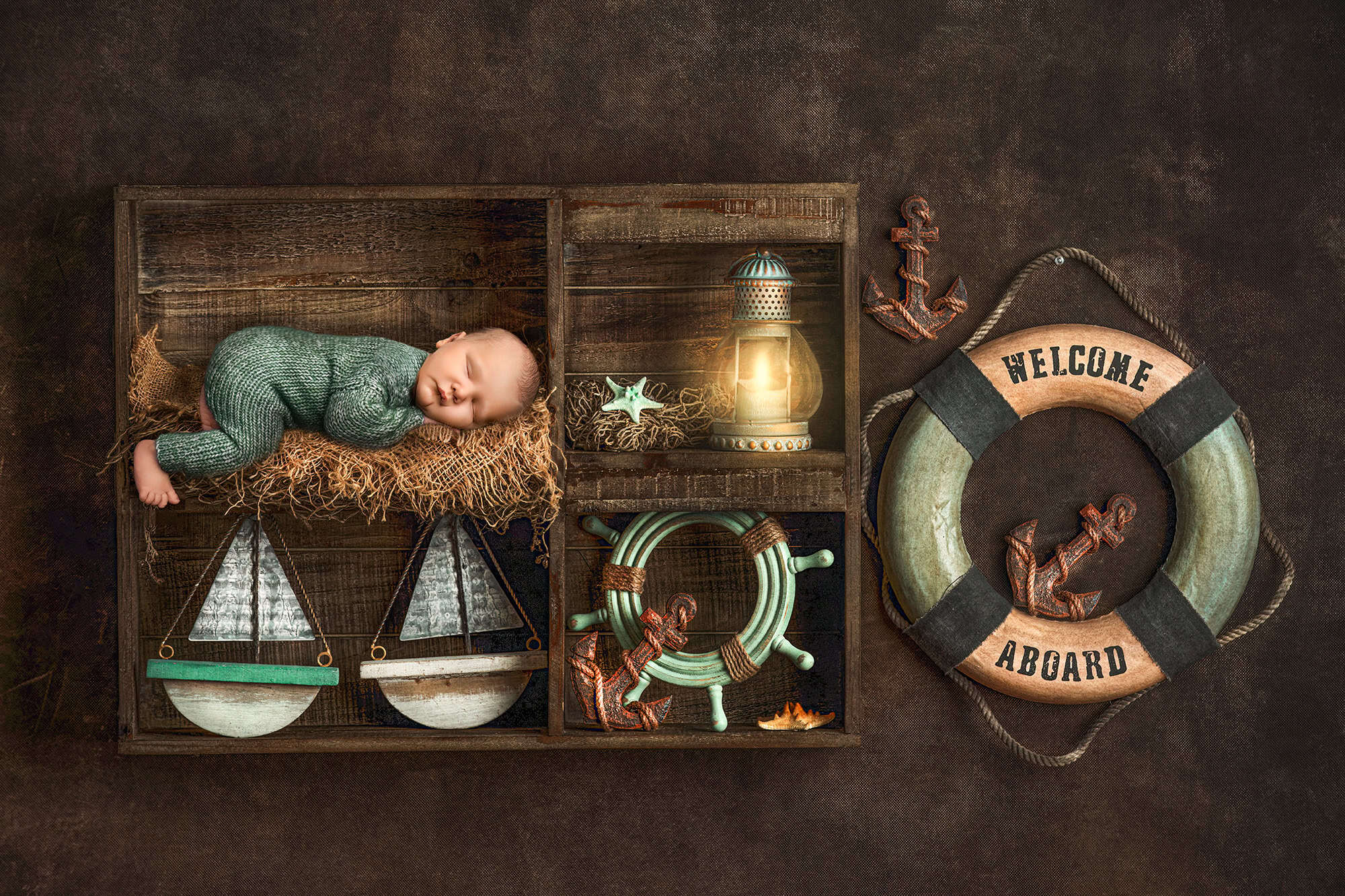 Newborn styled with nautical décor in wooden shelf at Glastonbury CT photography studio.