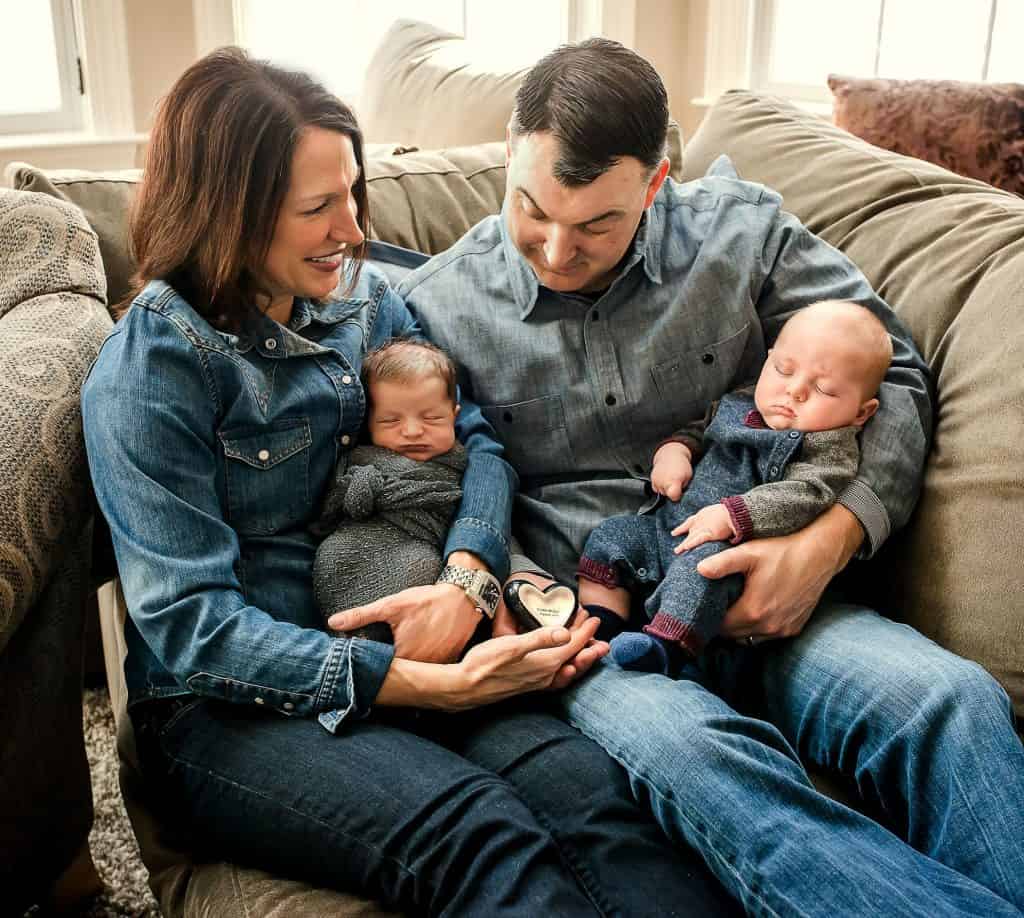 Mom, Dad, 3 month old son and newborn son with heart remembrance stone for baby they lost