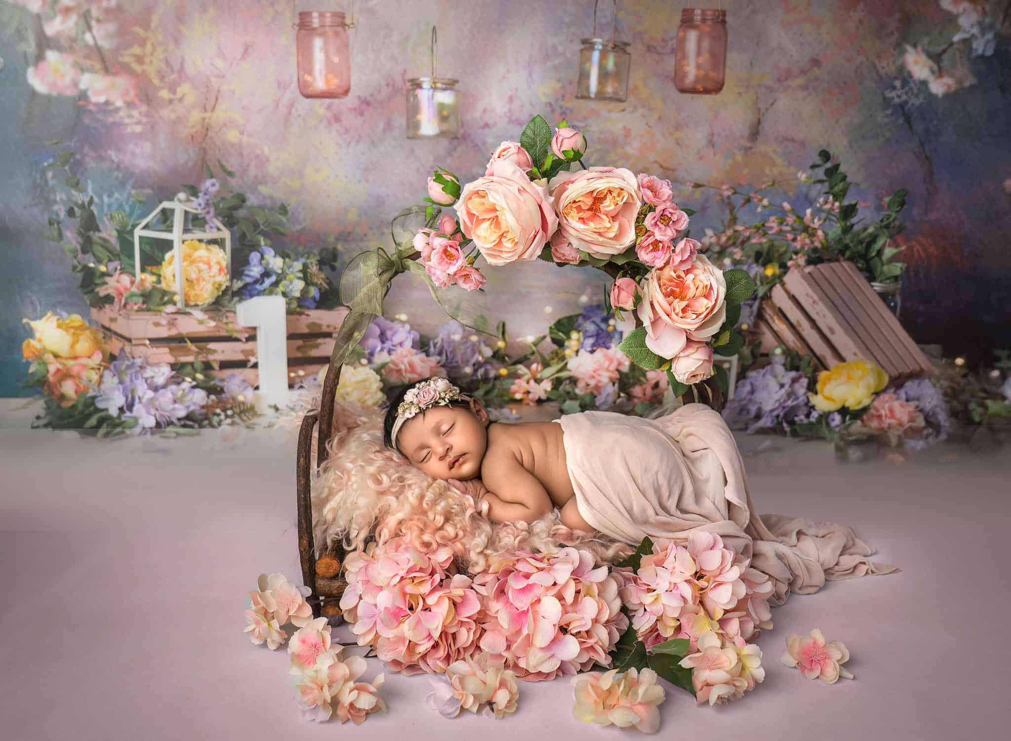 Dhanya in rustic wooden bed with pink roses and glowing lanterns