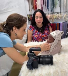 newborn photographer safely posing baby during photo session