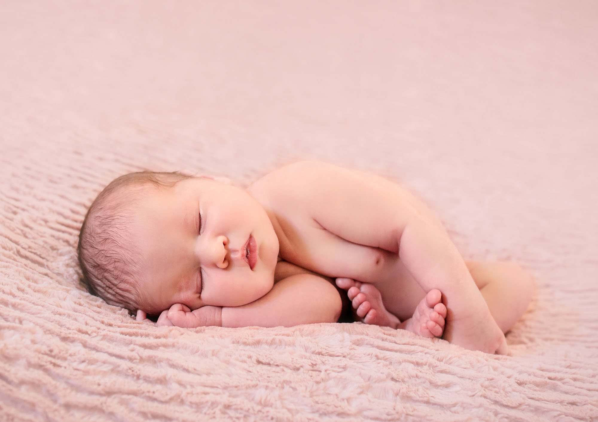 newborn baby girl sleeping in modified taco pose One Big Happy Photo